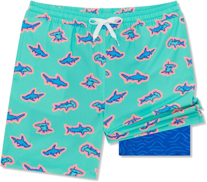 Kids’ swim trunks in ocean blue, modeled on a child at the beach