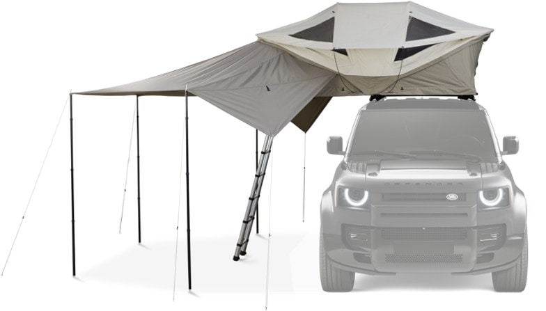 Thule Approach Compact Awning set up alongside a roof tent, showcasing sun protection.