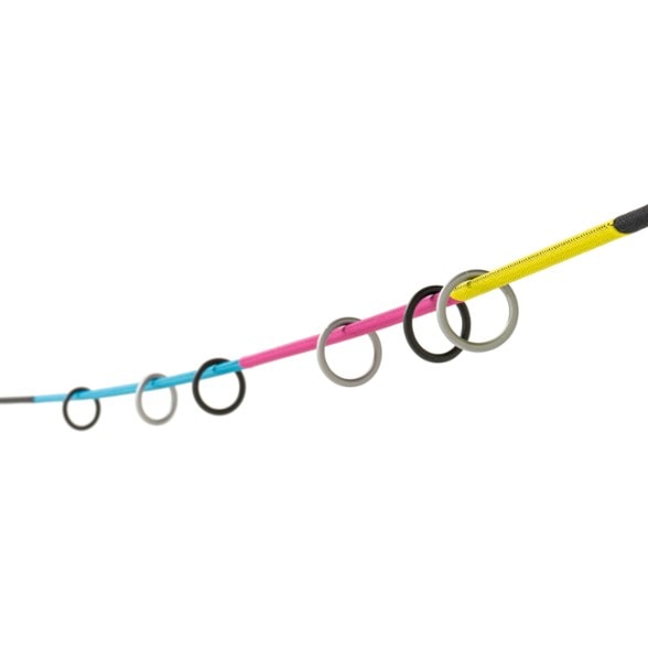 Helinox Trail Toss game laid out on a forest floor, showing metal rings and rope between two trees, ready for a camping ring toss game.