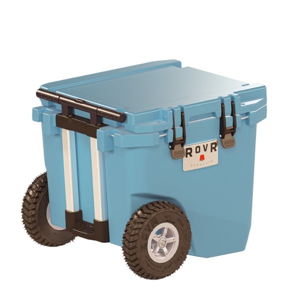 TrekMaster 45 Quart Wheeled Cooler with all-terrain tires on sandy beach.