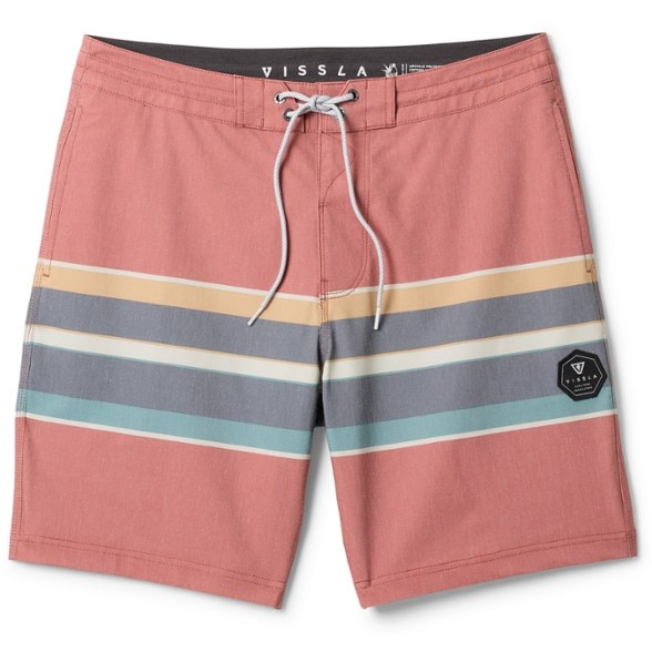 Men wearing Vissla board shorts at the beach, showcasing side pockets and UPF protection