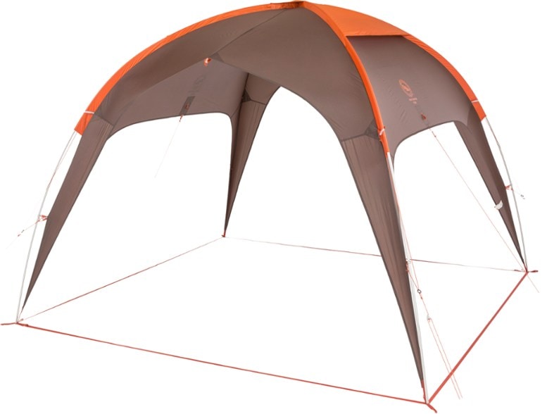 Large group shelter set up at campsite with sunny weather