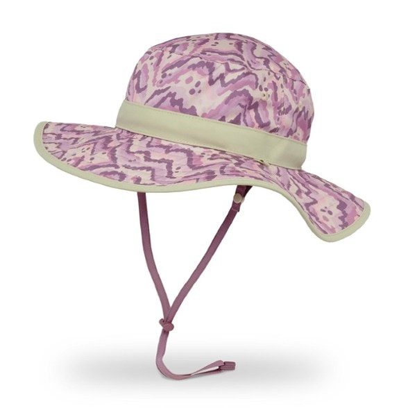 Child wearing top rated reversible kids sun hat with wide brim while hiking a forest trail