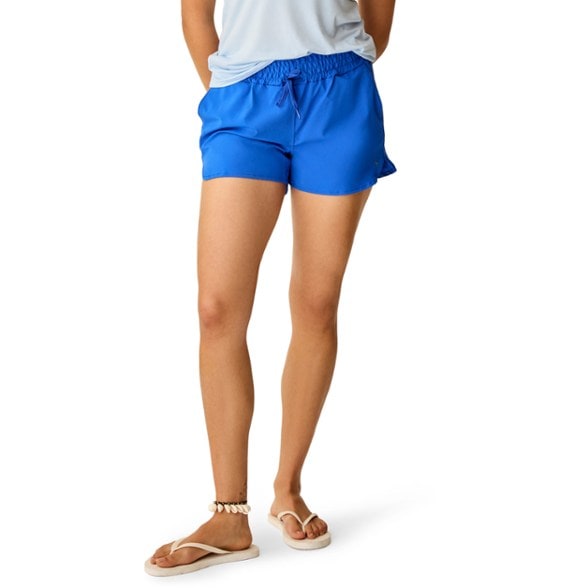 Eco-Friendly Bali Shorts for Women on the beach, showcasing their quick-drying fabric.